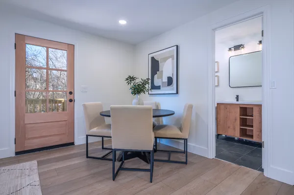 a view of a dining room with furniture window and wooden floor