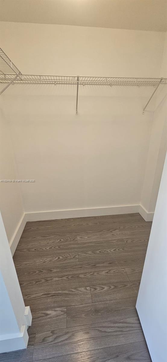 2775 Northeast 187th Street, Unit 424 Aventura, FL 33180 - Photo 13 of 16 a view of a room with racks on the wall
