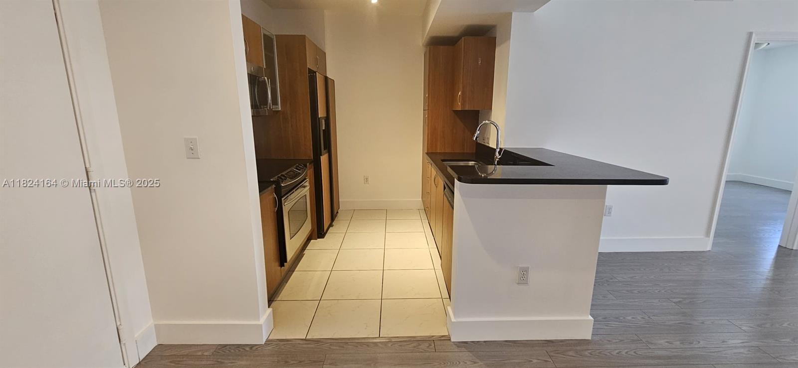 2775 Northeast 187th Street, Unit 424 Aventura, FL 33180 - Photo 2 of 16 a view of hallway with stairs