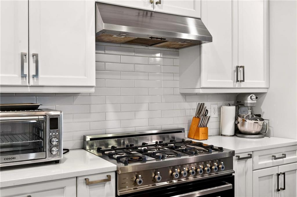 2974 Hermance Drive Northeast Atlanta, GA 30319 - Photo 10 of 38 a stove top oven sitting inside of a kitchen