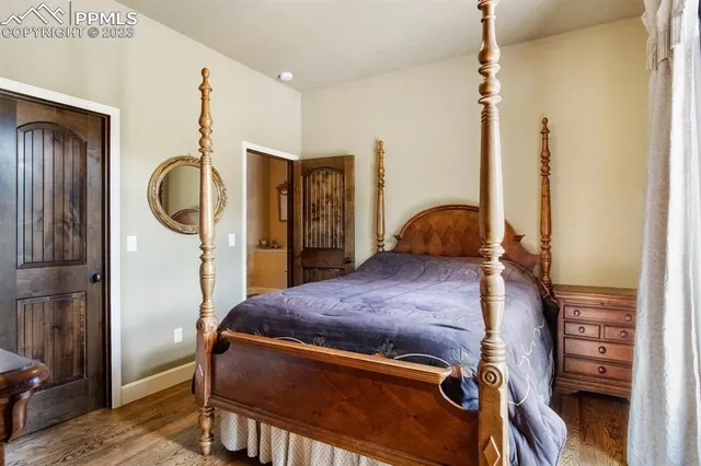 a bedroom with a bed and cabinets