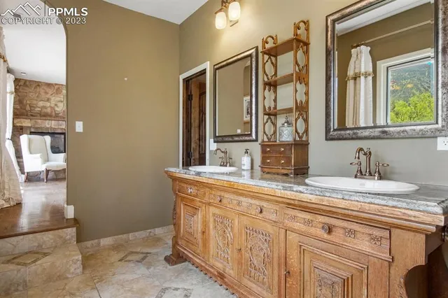 a bathroom with a granite countertop sink mirror and