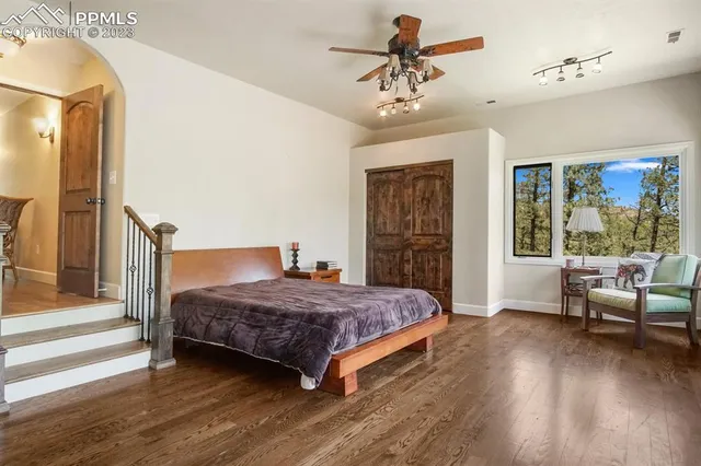 a bedroom with a bed and a couch