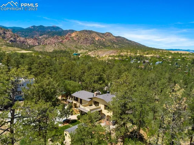 a view of a city with mountains in the background