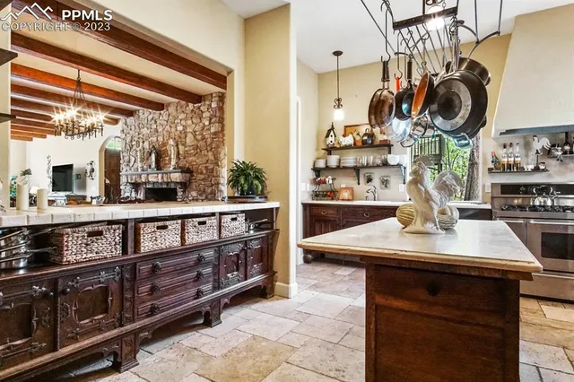 a kitchen with a sink and a stove