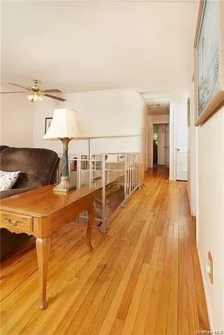 a view of a living room with wooden floor