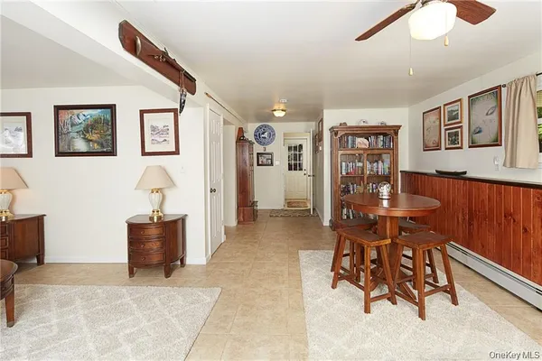 a view of a livingroom with furniture and window