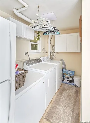 a kitchen with a sink appliances and cabinets