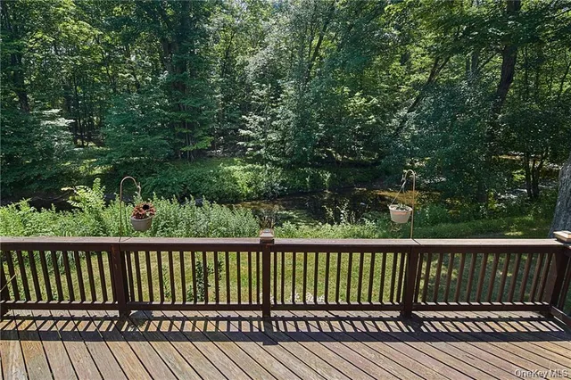 a view of balcony with wooden floor