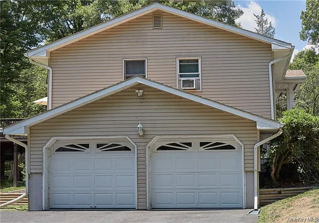 a front view of a house with garage