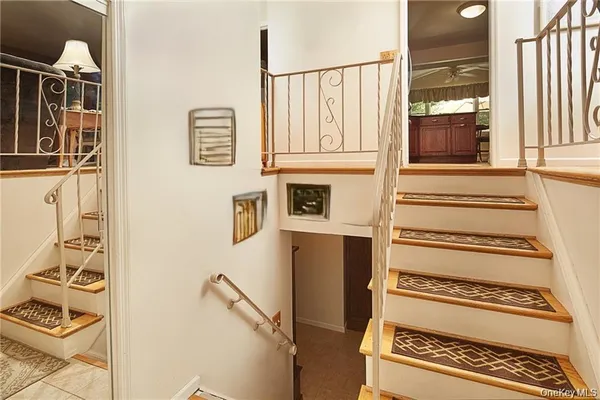 a view of an entryway with wooden floor