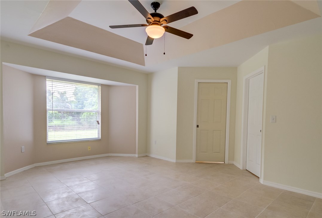 7232 Coolidge Road Fort Myers, FL 33967 - Photo 12 of 25 a view of a livingroom with a ceiling fan and window