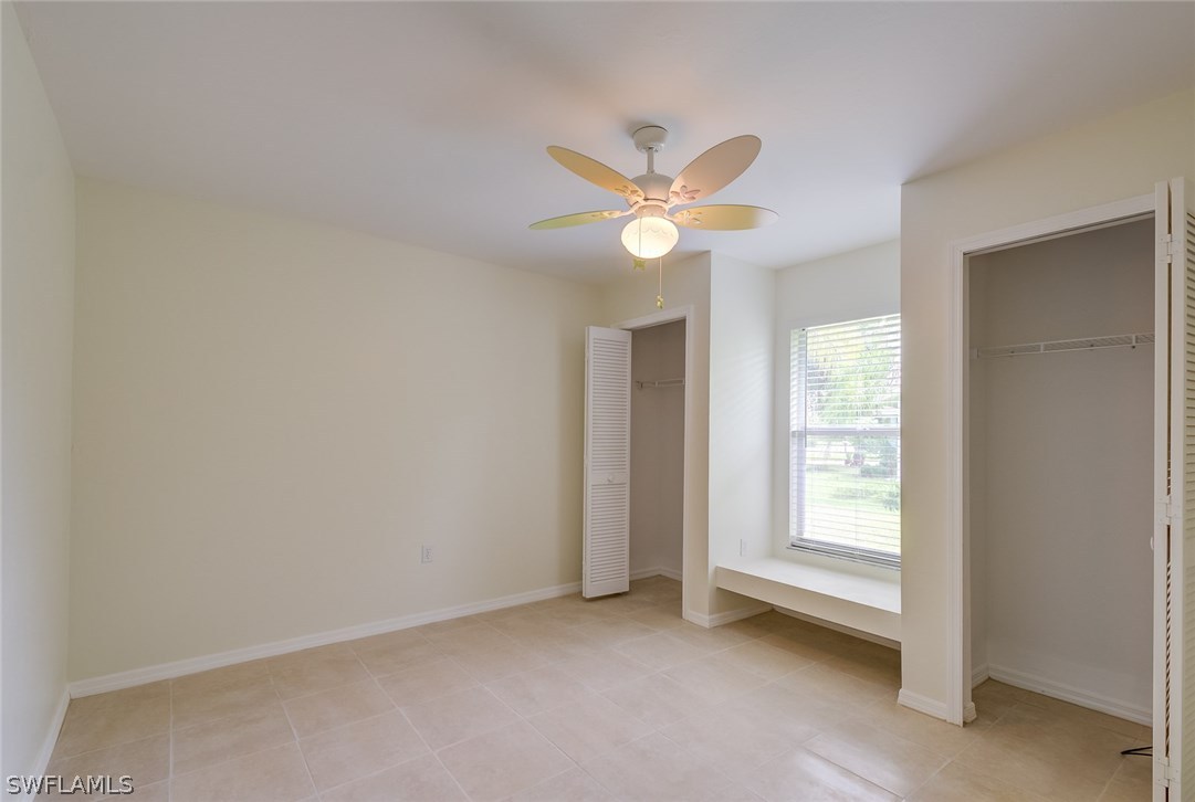 7232 Coolidge Road Fort Myers, FL 33967 - Photo 15 of 25 an empty room with a window and a fan
