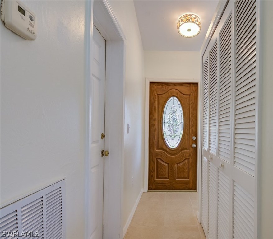 7232 Coolidge Road Fort Myers, FL 33967 - Photo 2 of 25 a view of an entryway with wooden floor