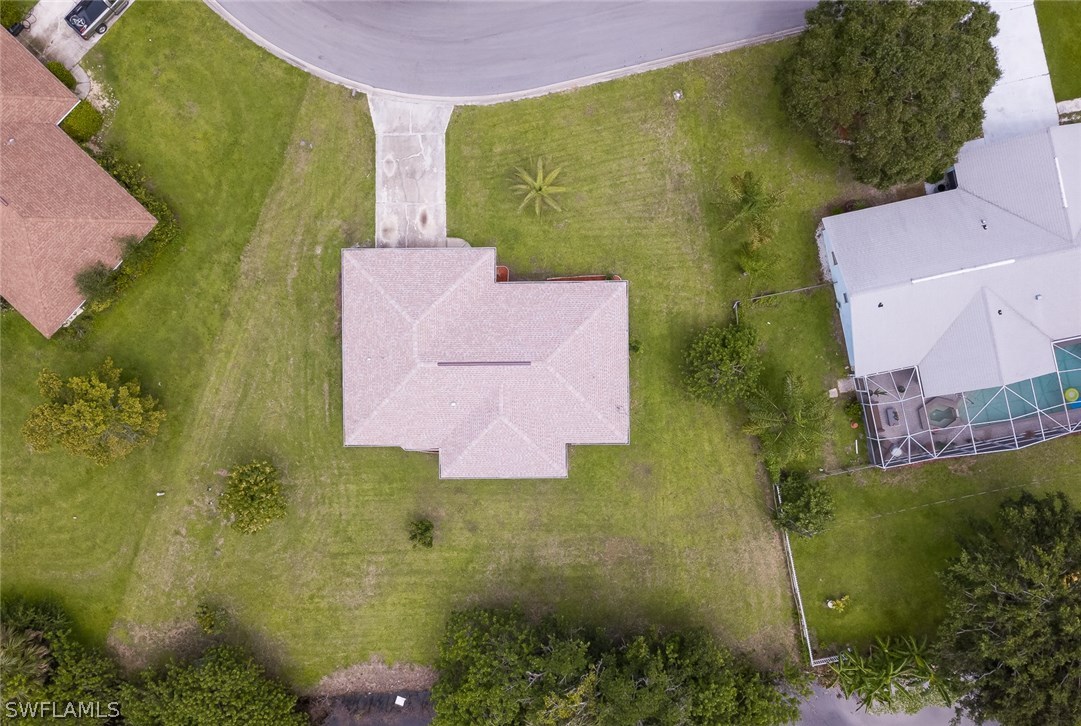 7232 Coolidge Road Fort Myers, FL 33967 - Photo 23 of 25 an aerial view of a house with a yard