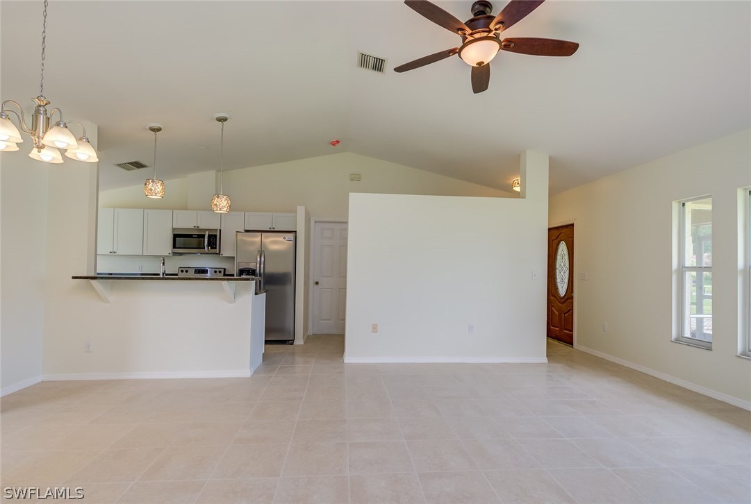 7232 Coolidge Road Fort Myers, FL 33967 - Photo 7 of 25 a view of a kitchen with refrigerator and window