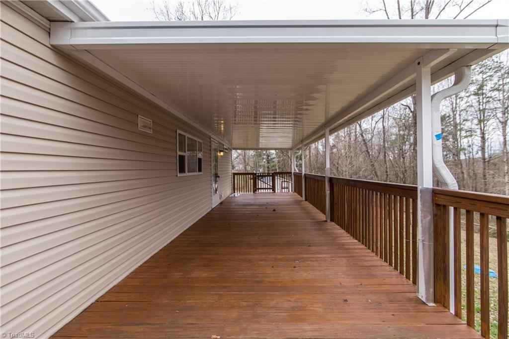 448 Spicer Road Elkin, NC 28621 - Photo 7 of 7 Back Exterior Covered Porch and Deck
