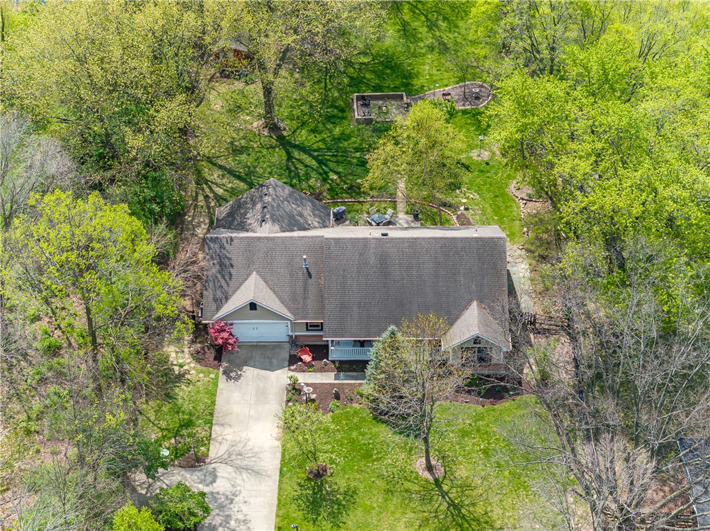 159 East Lytle 5 Points Road Springboro, OH 45066 - Photo 39 of 45 This elevated view captures a serene home amidst vibrant greenery, showcasing its spacious yard and driveway.
