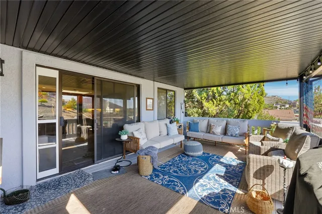 a outdoor space with patio the couches and a dining table with the garden view