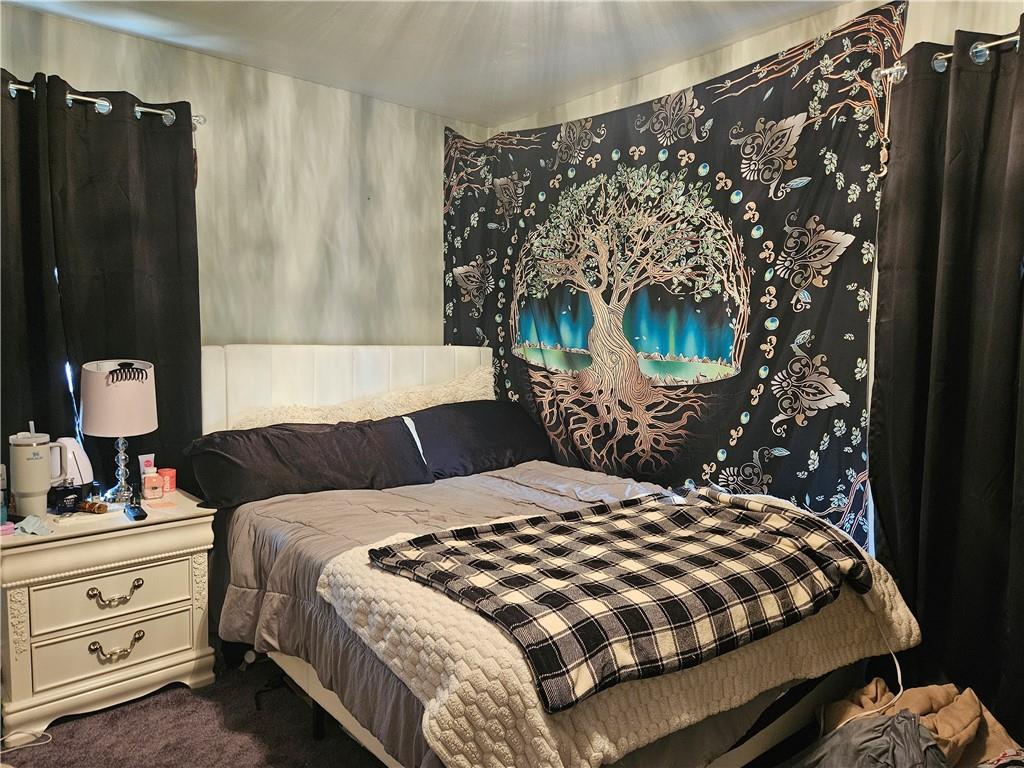 121 North Road Butler, PA 16001 - Photo 18 of 39 a bedroom with a bed and a mirror