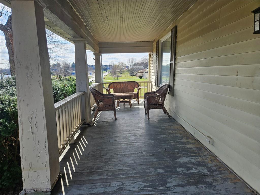 121 North Road Butler, PA 16001 - Photo 26 of 39 a porch with wooden floor