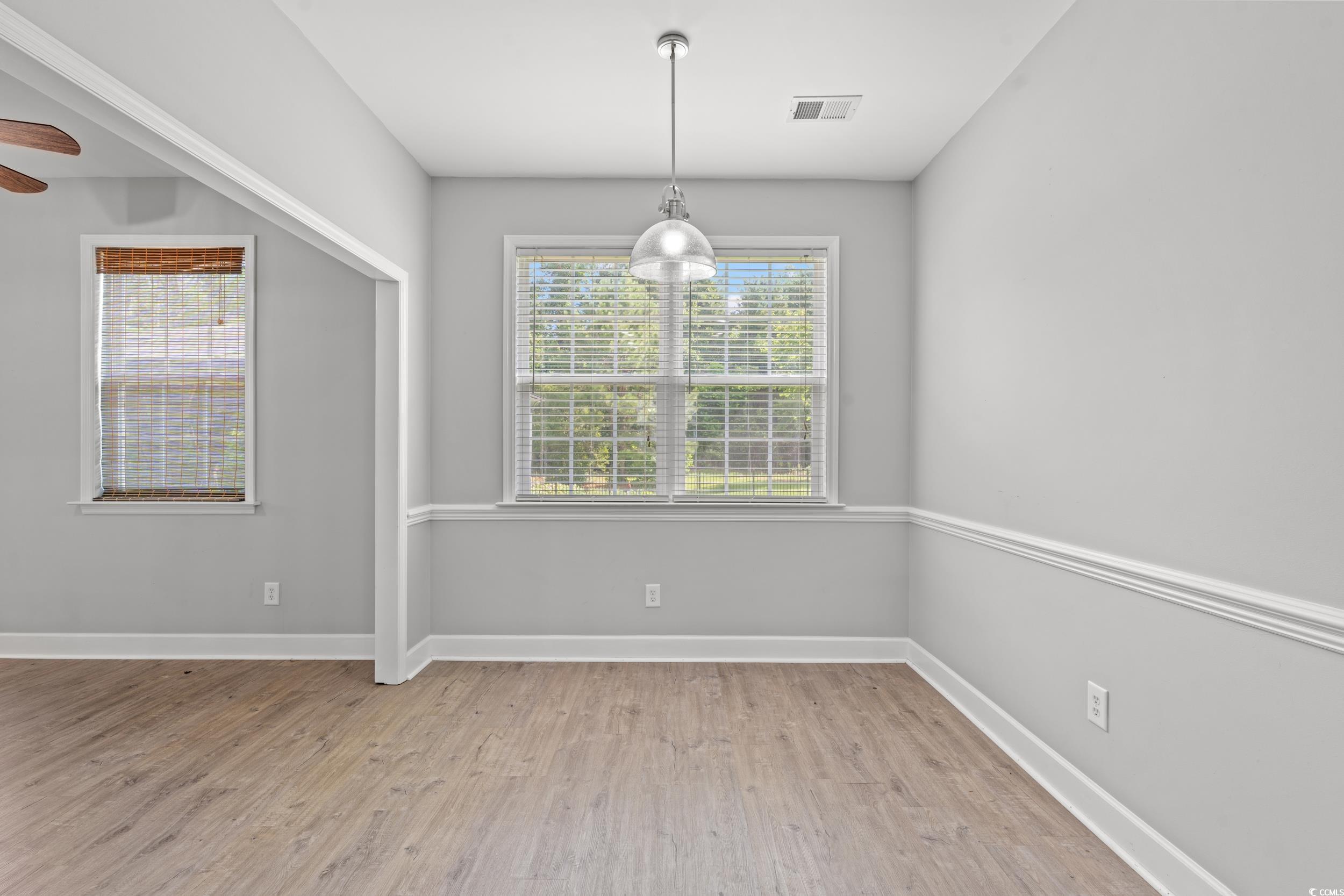 307 Russ Road Loris, SC 29569 - Photo 4 of 18 Unfurnished dining area featuring light wood-style floors and ceiling fan