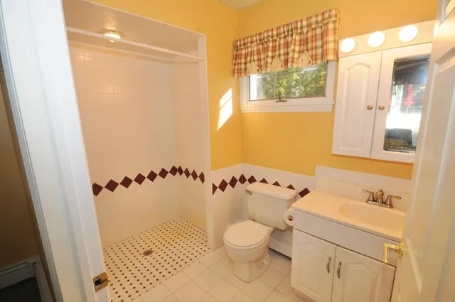 a bathroom with a sink and a shower