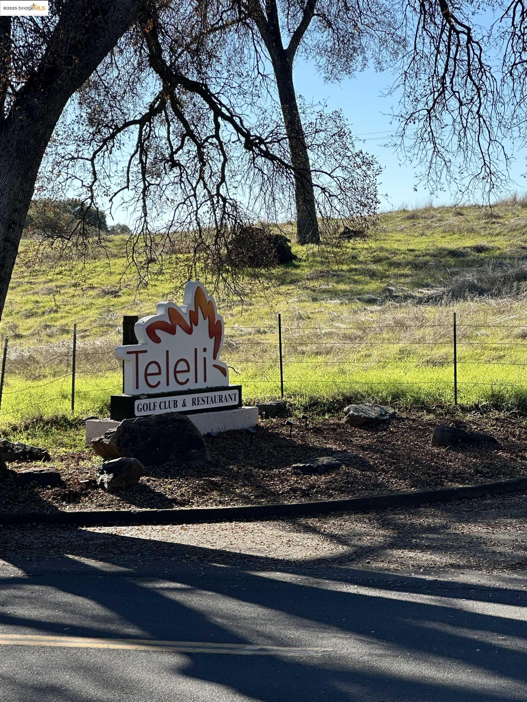 13788 Kincaid Flat Road Sonora, CA 95370 - Photo 2 of 12 a front view of a house with a yard