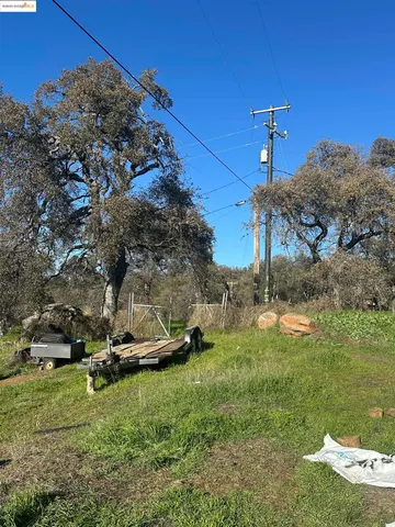a backyard of a house with a yard and outdoor seating