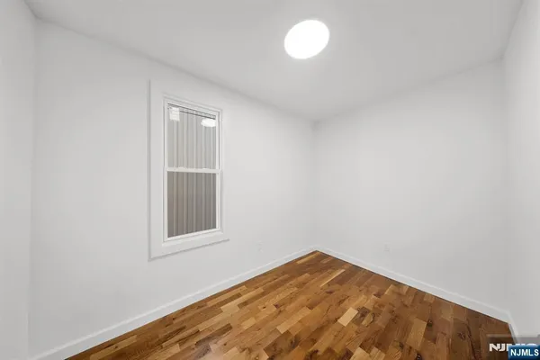 a view of a bathroom with 2 sink and a toilet