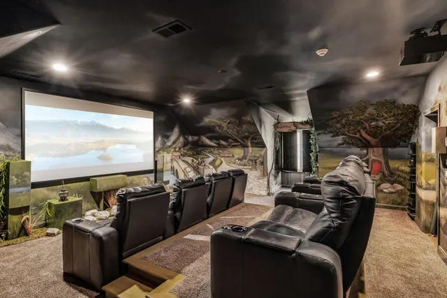 a kitchen with stainless steel appliances kitchen island granite countertop a stove and a refrigerator