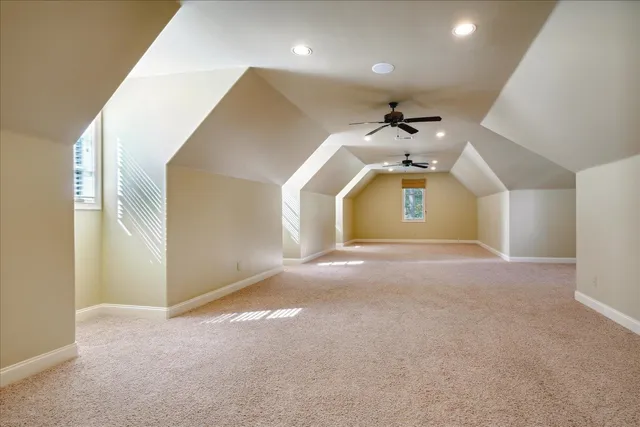 a view of a kitchen with a sink and a ceiling fan