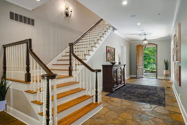 a view of a hallway with staircase