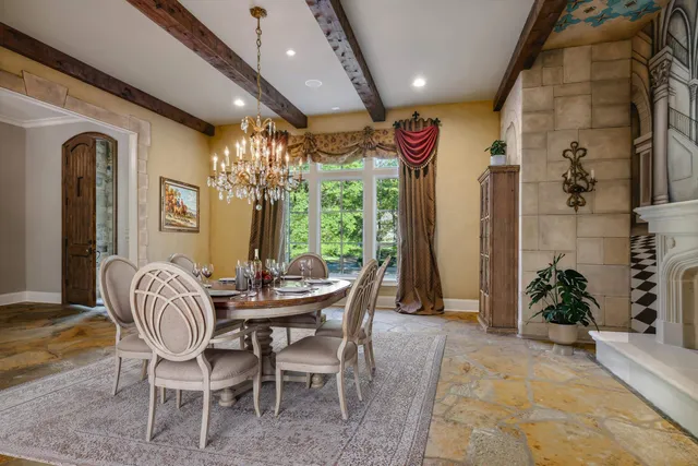 a dining room with furniture and window