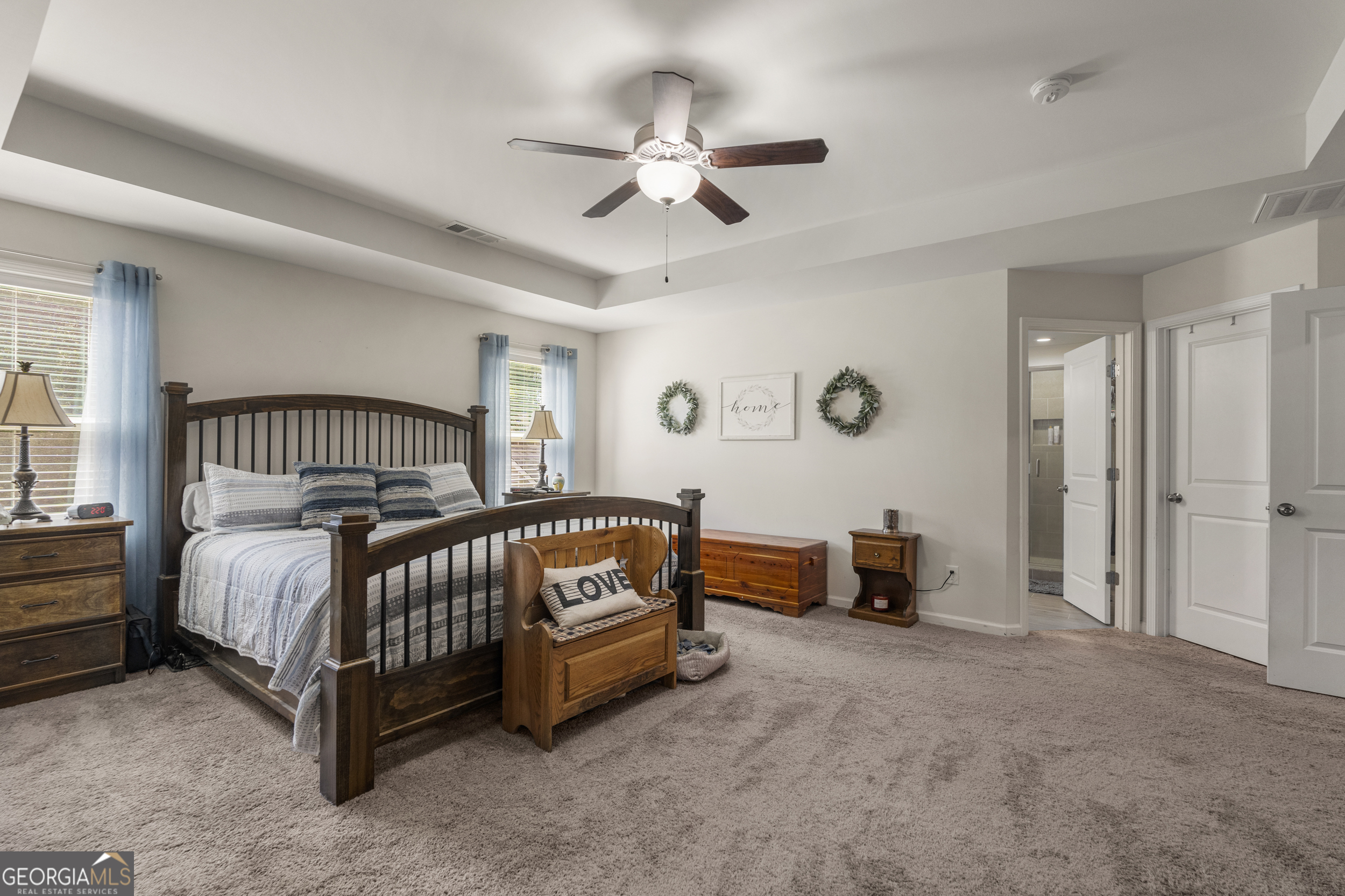 209 Marsh Road West Point, GA 31833 - Photo 22 of 50 a bedroom with a bed and a chandelier
