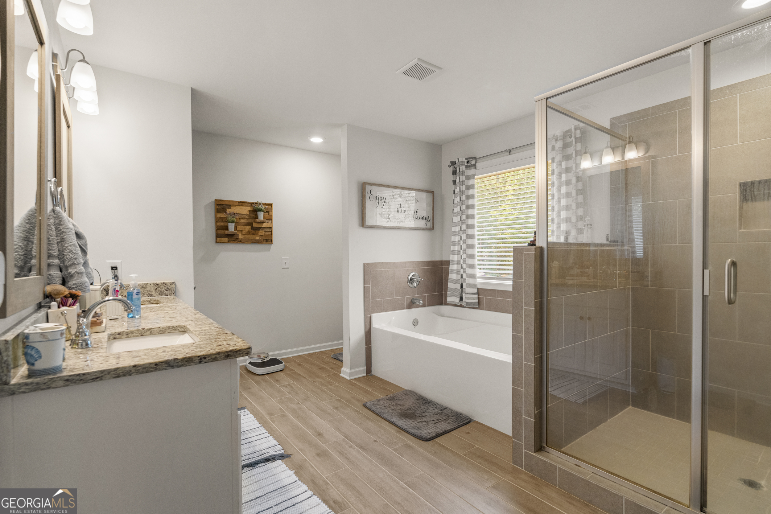 209 Marsh Road West Point, GA 31833 - Photo 23 of 50 a bathroom with a double vanity sink mirror and shower