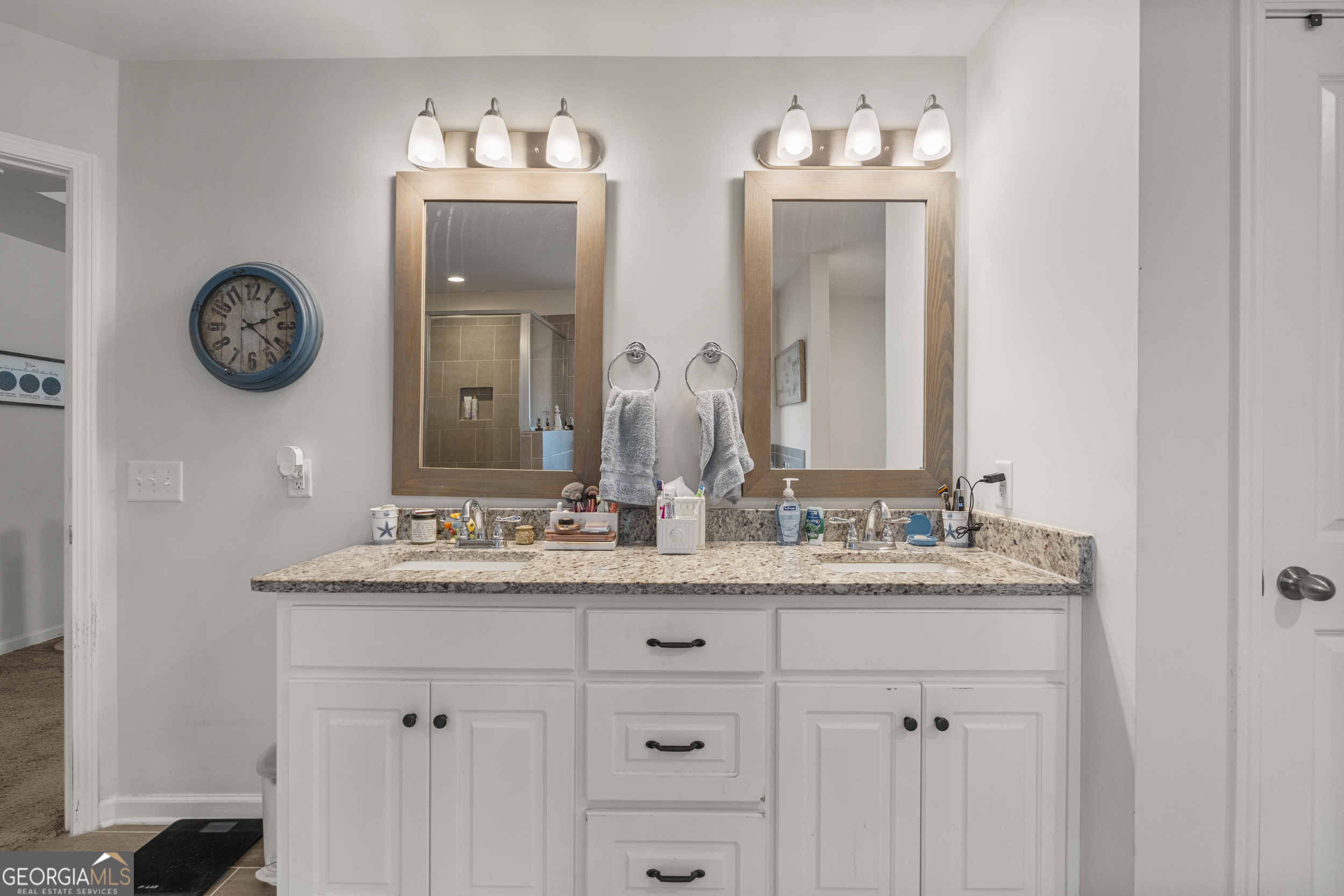 209 Marsh Road West Point, GA 31833 - Photo 27 of 50 a bathroom with a double vanity sink and a mirror