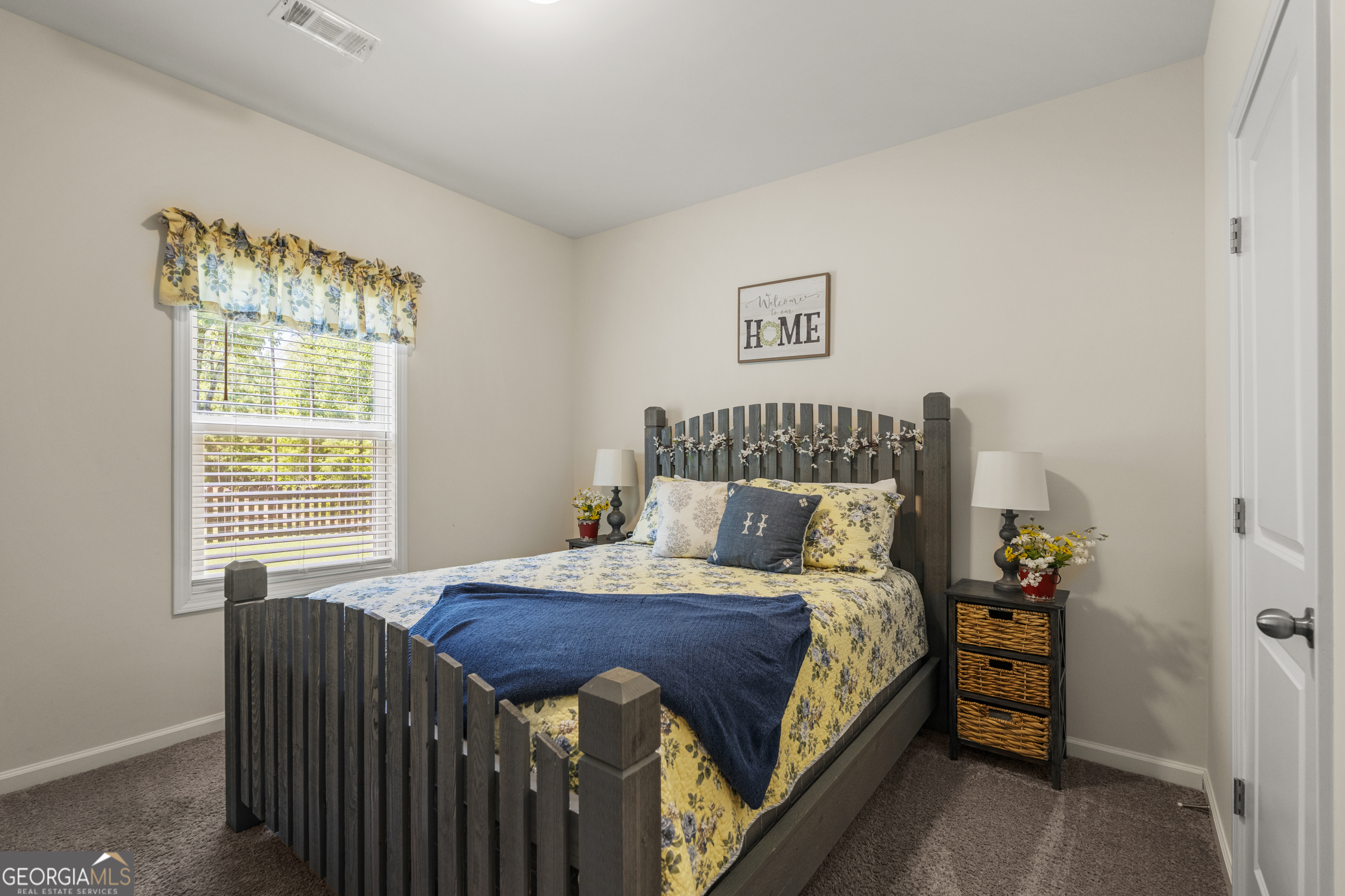 209 Marsh Road West Point, GA 31833 - Photo 30 of 50 a bedroom with a bed and a window