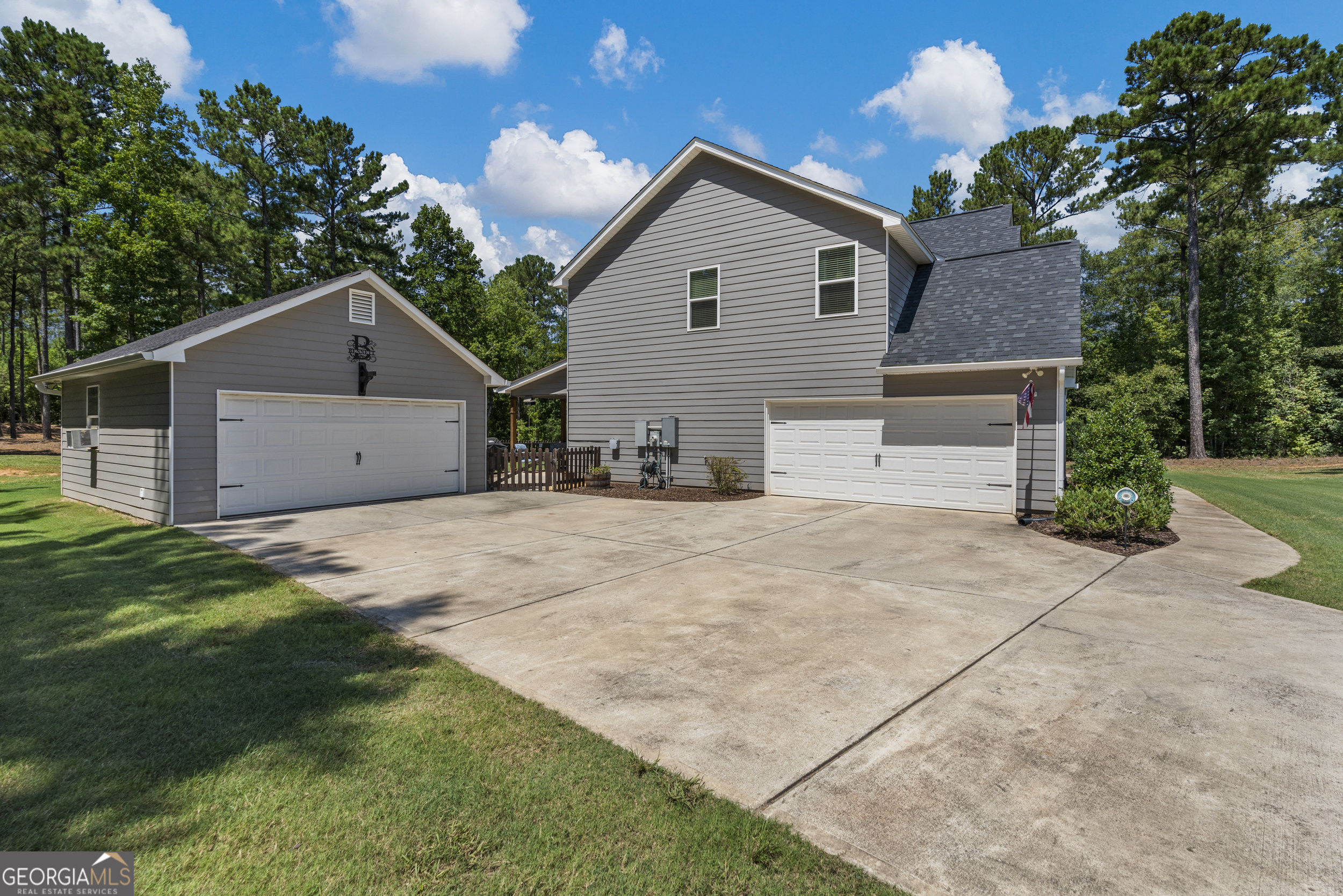 209 Marsh Road West Point, GA 31833 - Photo 39 of 50 a view of a house with a yard and a garage
