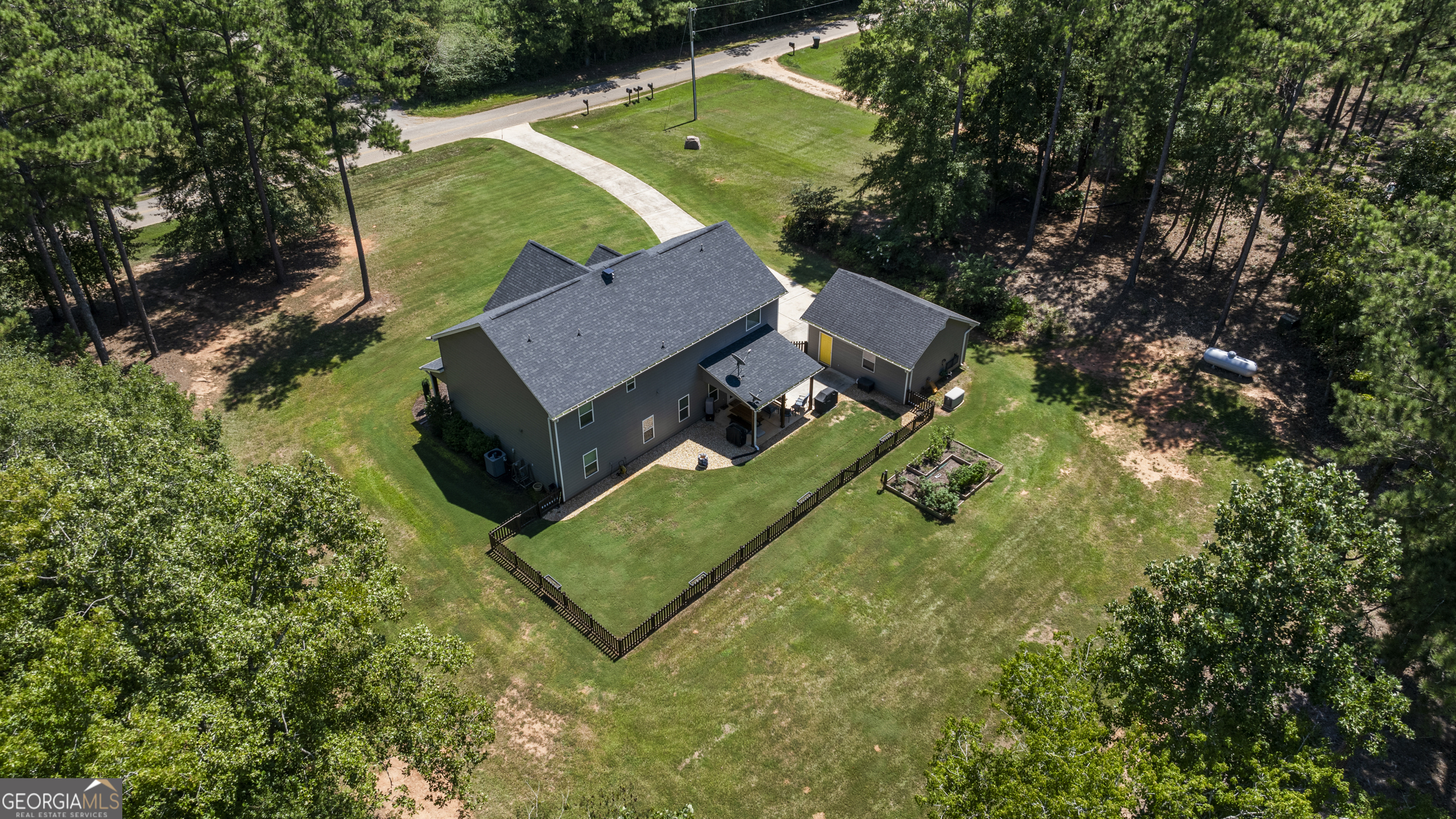 209 Marsh Road West Point, GA 31833 - Photo 45 of 50 an aerial view of a house with a garden and trees