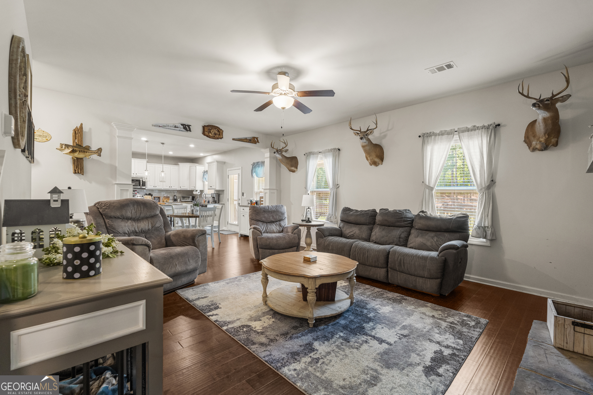209 Marsh Road West Point, GA 31833 - Photo 5 of 50 a living room with furniture a rug and a chandelier