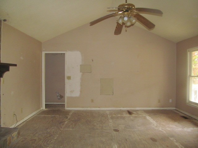 6501 Barfield Road Macon, GA 31216 - Photo 6 of 13 an empty room with chandelier fan and windows