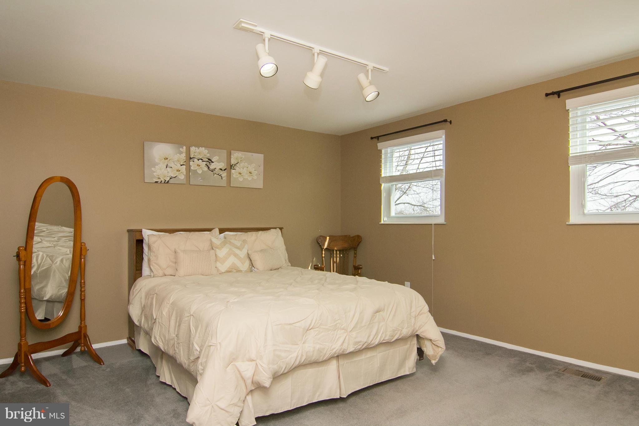 343 Timber Grove Road Owings Mills, MD 21117 - Photo 17 of 29 a bedroom with a bed and a window