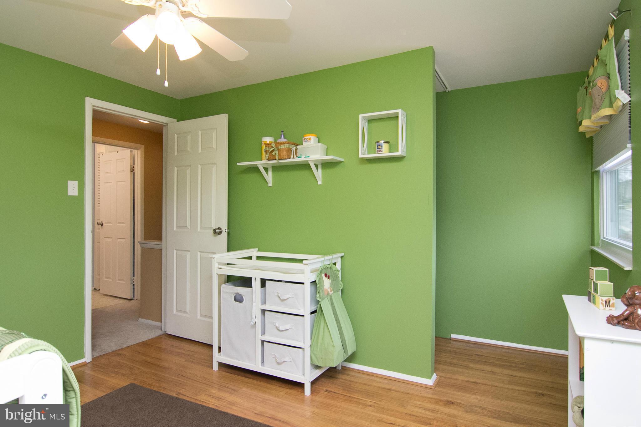 343 Timber Grove Road Owings Mills, MD 21117 - Photo 20 of 29 a room with cabinets and wooden floor