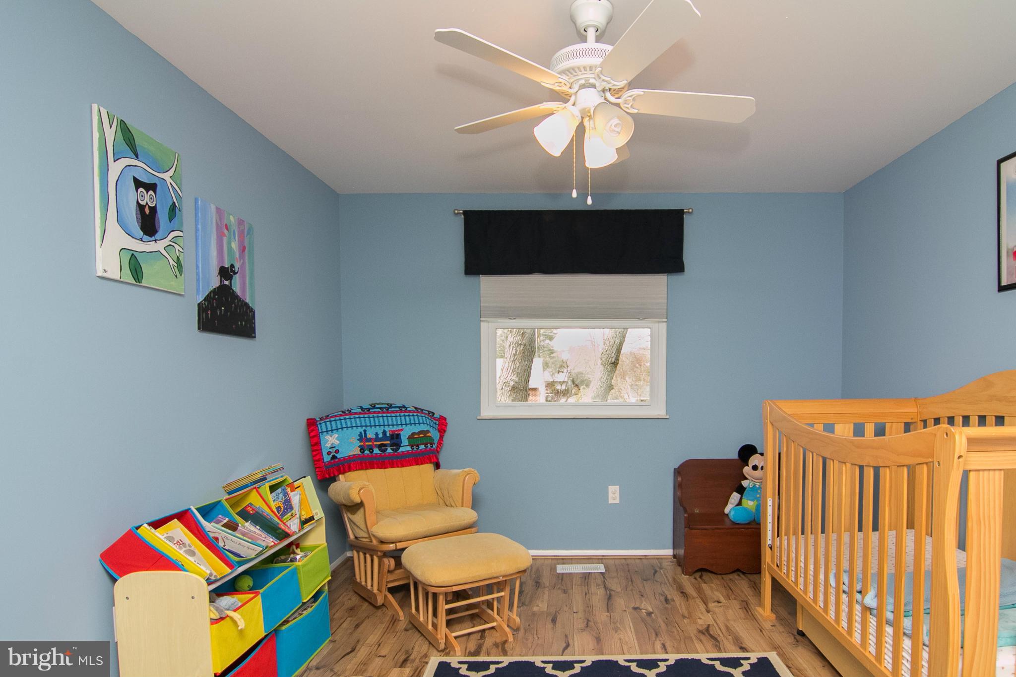 343 Timber Grove Road Owings Mills, MD 21117 - Photo 21 of 29 a living room with furniture and a baby crib
