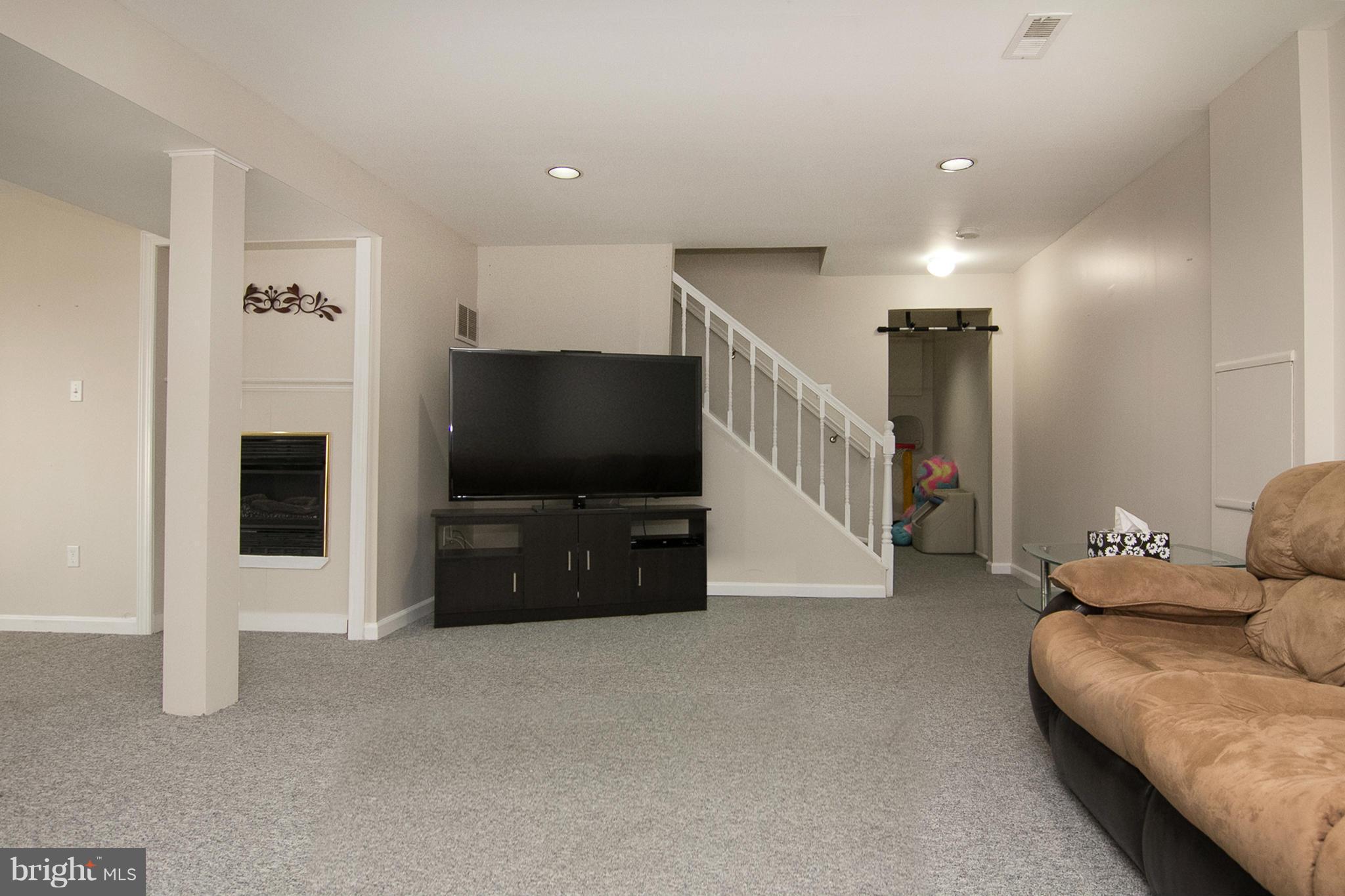 343 Timber Grove Road Owings Mills, MD 21117 - Photo 24 of 29 a living room with furniture and a flat screen tv