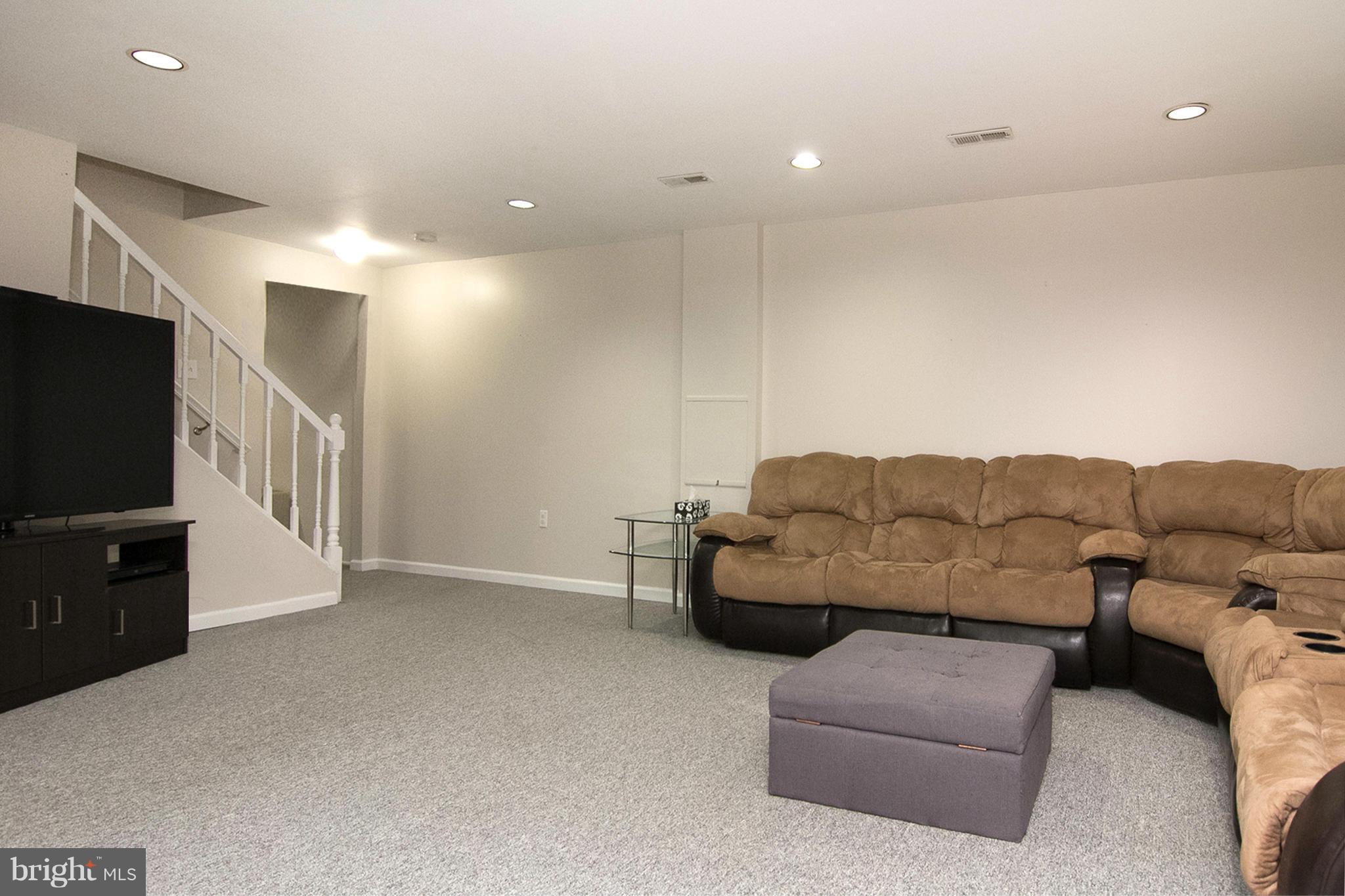 343 Timber Grove Road Owings Mills, MD 21117 - Photo 25 of 29 a living room with furniture and a flat screen tv