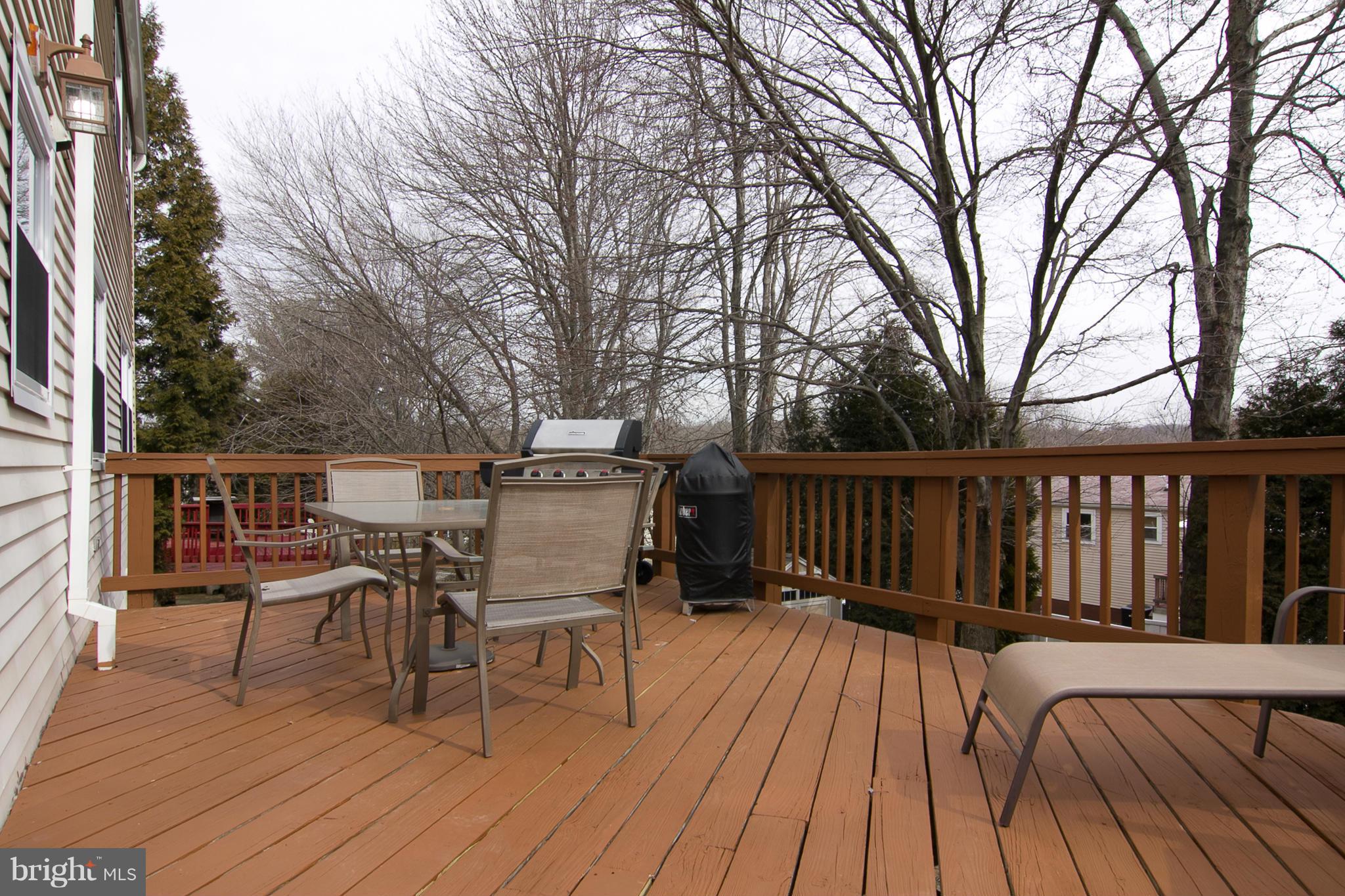 343 Timber Grove Road Owings Mills, MD 21117 - Photo 28 of 29 a view of deck with table and chairs and wooden floor