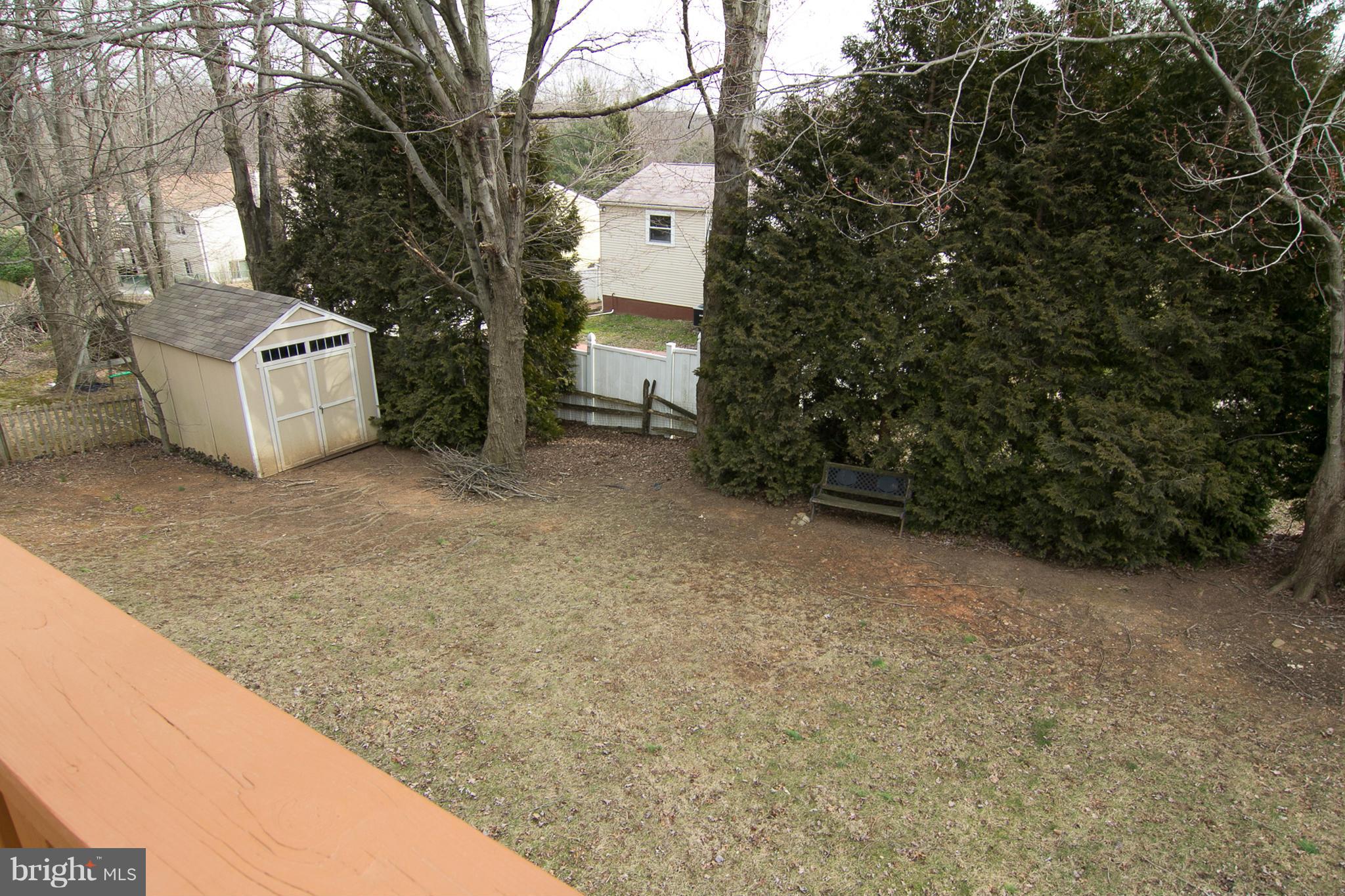 343 Timber Grove Road Owings Mills, MD 21117 - Photo 29 of 29 a view of a house with a tree and fence
