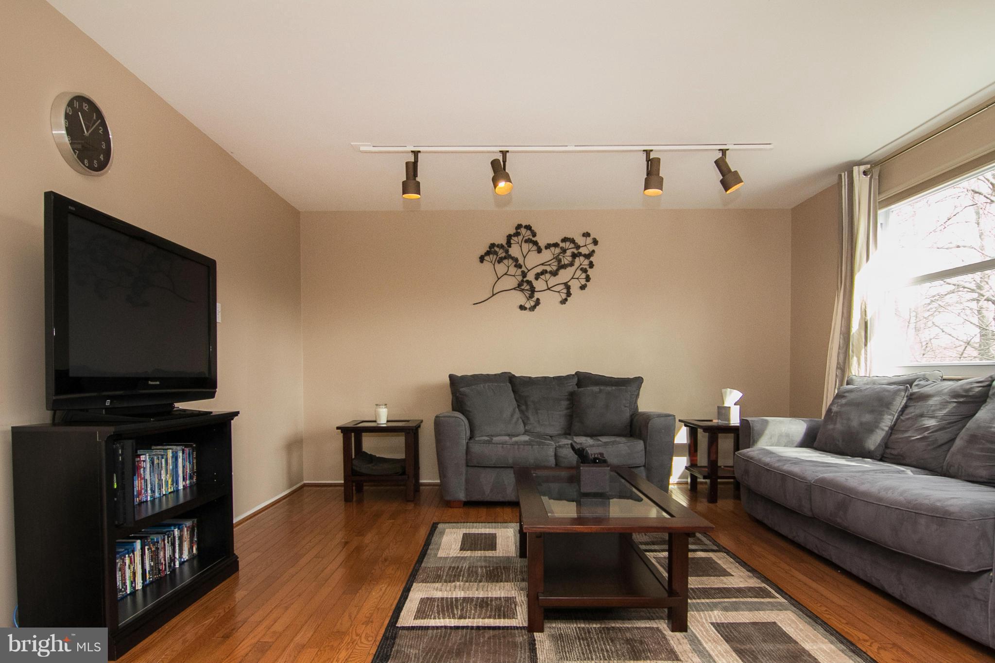 343 Timber Grove Road Owings Mills, MD 21117 - Photo 5 of 29 a living room with furniture and a flat screen tv
